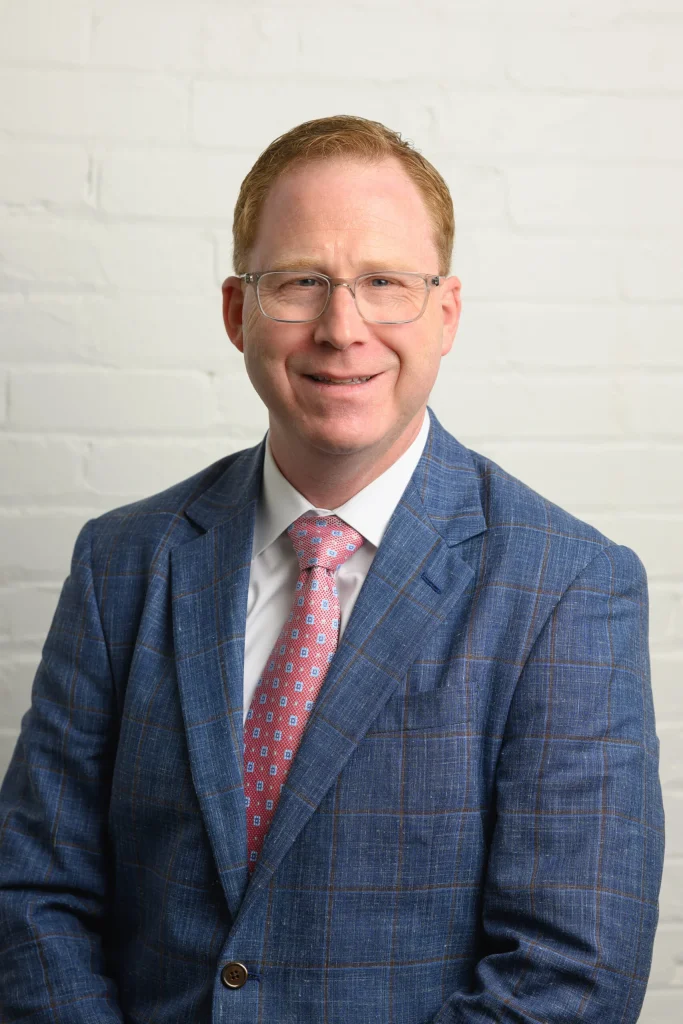 Dr. Brian E. Woodruff, board-certified pediatric neurologist, medical expert witness, and co-host of the Expert Witness Playbook podcast.
